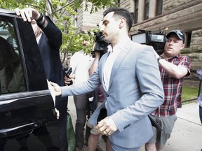 Hedley frontmanJacob Hoggard leaves an Old City Hall court after the first day of his preliminary hearing on July 11, 2019.