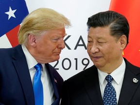 U.S. President Donald Trump meets with China's President Xi Jinping at the start of their bilateral meeting at the G20 leaders summit in Osaka, Japan, June 29, 2019. REUTERS/Kevin Lamarque/File Photo
