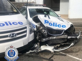 A NSW Police handout photo shows the wreckage of a police patrol car after it was hit by a van laden with methamphetamines outside a police station in Eastwood, north of Sydney in Australia July 22, 2019. (New South Wales Police Force/Handout via REUTERS)