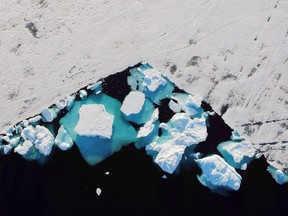 An iceberg floats in a fjord near the town of Tasiilaq, Greenland, June 18, 2018. REUTERS/Lucas Jackson/File Photo