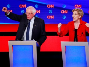 U.S. Senator Bernie Sanders and U.S. Senator Elizabeth Warren speak on the first night of the second 2020 Democratic U.S. presidential debate in Detroit, Michigan, U.S., July 30, 2019. REUTERS/Lucas Jackson