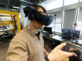 Brendan Concannon, Faculty of Rehabilitation Medicine master student, demonstrates a virtual reality setup that simulates mock patient interviews that are normally played by an actor during the students' Objective Structured Clinical Exam at the University of Alberta in Edmonton, on Friday, June 14, 2019.