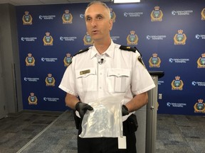 Winnipeg Police Service Inspector Max Waddell displays seized purple heroin on July 24, 2019. Scott Billeck/Winnipeg Sun/Postmedia Network