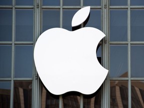 The Apple logo is seen on the outside of Bill Graham Civic Auditorium in San Francisco.