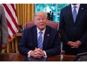 U.S. President Donald Trump speaks to the press after signing a bill for border funding legislation in the Oval Office at the White House in Washington, D.C., on July 1, 2019.