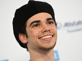 In this file photo taken on April 25, 2019 US actor Cameron Boyce arrives for WE Day California at the Forum in Inglewood, California.
