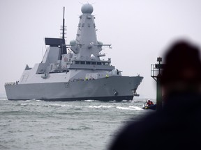 A March 22, 2013 handout photo released by Britain's Ministry of Defence (MoD) in London on July 12, 2019, shows the British Royal Navy's HMS Duncan, a Type 45 Destroyer, as it prepares to arrive in Portsmouth, southern England. - Britain on July 12, 2019, brought forward a pre-planned rotation of warships in the Gulf that will see two vessels temporarily stationed near Iranian waters. A government spokesman said the HMS Duncan was "deploying to the region to ensure we maintain a continuous maritime security presence while HMS Montrose comes off task for pre-planned maintenance and crew change over"