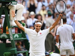 Switzerland's Roger Federer celebrates beating Spain's Rafael Nadal during their men's singles semi-final match on day 11 of the 2019 Wimbledon Championships at The All England Lawn Tennis Club in Wimbledon, southwest London, on July 12, 2019.