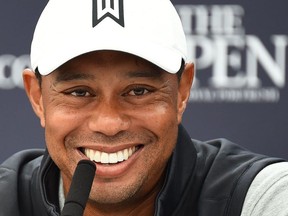 US golfer Tiger Woods takes part in a press conference at The 148th Open golf Championship at Royal Portrush golf club in Northern Ireland on July 16, 2019.