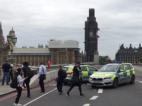 In this file video grab taken on August 14, 2018, taken from AFP TV video footage  police officers cordon off Westminster Bridge, leading to Parliament Square in central London, after a car was driven into barriers at the Houses of Parliament. (WILLIAM EDWARDS/AFP/Getty Images)