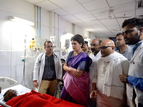On July 19, 2019, Indian politician Priyanka Gandhi Vadra (2L) meets Sonbhadra massacre victims at the Banaras Hindu University (BHU) Trauma Centre in Varanasi. - Nine people were killed on July 17, after two groups clashed over a disputed patch of farmland in the northern Indian state of Uttar Pradesh, police said. Three others were injured during the fighting that broke-out after a local politician tried to take possession of a piece of land from residents of Sapahi village in state's remote Sonbhadra district. (AFP/Getty Images)