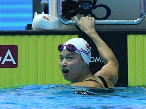 Canada's Margaret Macneil celebrates winning the final of the women's 100m butterfly event during the swimming competition at the 2019 World Championships at Nambu University Municipal Aquatics Center in Gwangju, South Korea, on July 22, 2019.