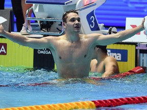 Hungary's Kristof Milak celebrates taking gold in the final of the men's 200m butterfly event during the swimming competition at the 2019 World Championships at Nambu University Municipal Aquatics Center in Gwangju, South Korea, on July 24, 2019. (Oli SCARFF / AFP)OLI SCARFF/AFP/Getty Images)