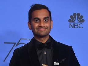 In this photo taken on January 7, 2018, Actor Aziz Ansari poses with the trophy for Best Performance by an Actor in a Television Series - Musical or Comedy during the 75th Golden Globe Awards in Beverly Hills, California.