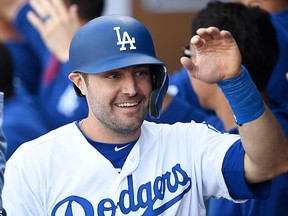 A.J. Pollock of the Los Angeles Dodgers is congratulated after scoring against the Arizona Diamondbacks at Dodger Stadium on March 31, 2019 in Los Angeles. (Kevork Djansezian/Getty Images)