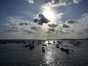 Fishing boats float in Kedonganan, near Denpasar on Indonesia's resort island of Bali on July 15, 2019. (SONNY TUMBELAKA/AFP/Getty Images)