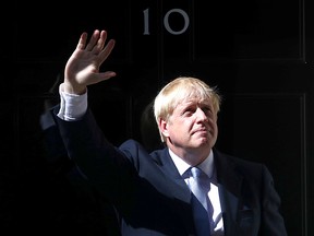 Britain's new Prime Minister, Boris Johnson, enters Downing Street, in London July 24, 2019. (REUTERS/Hannah McKay)