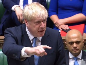 A video grab from footage broadcast by the UK Parliament's Parliamentary Recording Unit (PRU) shows Britain's new Prime Minister Boris Johnson making a statement in the House of Commons in London on July 25, 2019.