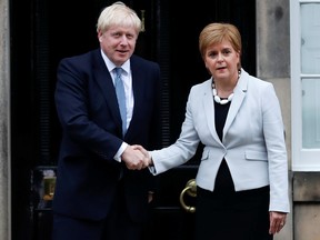 Britain's Prime Minister Boris Johnson shakes hands with Scotland's First Minister Nicola Sturgeon at Bute House in Edinburgh, Scotland, July 29, 2019. (REUTERS/Russell Cheyne)