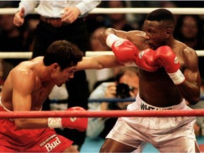 Oscar De La Hoya lands a punch to the body of Pernell Whitaker during their WBC Welterweight Championship fight in Las Vegas, April 12 1997.
