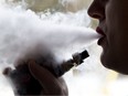 An unnamed woman blows smoke out of his mouth during a vaping sesson on Thursday February 21, 2019 in Brantford, Ontario. Brian Thompson/Brantford Expositor/Postmedia Network