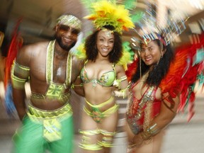 Toronto Revellers masqueraders Paul Anthony Perez, Mahogany Brown and Melissa Sobers were at Toronto Police Headquarters there Caribbean Carnival kick-off on Aug. 3 weekend on Friday, July 26, 2019.