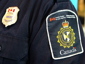 A Canadian Border Services Agency (CBSA) officer's shoulder flash is shown in Calgary, Alta on Saturday April 22, 2017. (Jim Wells//Postmedia)