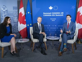 European Commissioner for Trade Cecilia Malmstrom and President of the European Council Donald Tusk listen to Prime Minister Justin Trudeau deliver remarks prior to a meeting in Montreal on Thursday, July 18, 2019.