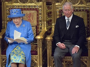 Queen Elizabeth II delivers the Queen's Speech whilst sat next to Prince Charles, Prince of Wales during the State Opening of Parliament in the House of Lords at the Palace of Westminster on June 21, 2017 in London.