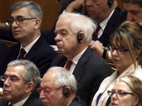 CP-Web.  Canada's ambassador to China John McCallum, center, attends a conference to commemorate the 40th anniversary of China's Reform and Opening Up policy at the Great Hall of the People in Beijing, Tuesday, Dec. 18, 2018.