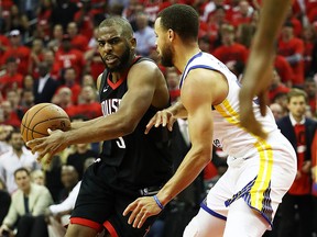 Chris Paul of the Houston Rockets drives against Stephen Curry of the Golden State Warriors at Toyota Center on May 16, 2018 in Houston. (Ronald Martinez/Getty Images)