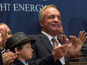 Foresight Energy LP's Chairman Christopher Cline, right, rings the opening bell at the New York Stock Exchange, U.S., June 19, 2014. (REUTERS/Brendan McDermid)