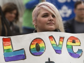 Protestors rally outside the Alberta Legislature in support of banning conversion therapy, in Edmonton Thursday June 6, 2019. (David Bloom/Postmedia)