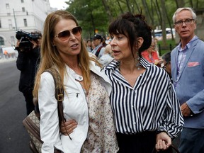 Catherine Oxenberg and Toni Natalie embrace after the guilty verdicts in the sex trafficking and racketeering case against Nxivm cult founder Keith Raniere outside the Brooklyn Federal Courthouse in New York, U.S., June 19, 2019. (REUTERS/Shannon Stapleton)
