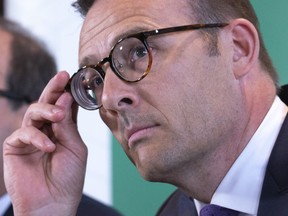 Desjardins President and CEO Guy Cormier listens to a question during a news conference in Montreal onJune 20, 2019.The chief executive of Desjardins Group says it will offer permanent data protection to all its members -- and not just those affected by a massive personal data breach reported last month.