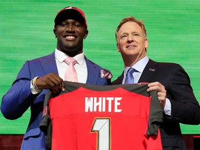 Devin White of LSU poses with NFL commissioner Roger Goodell after being chosen fifth overall by the Tampa Bay Buccaneers during the first round of the 2019 NFL Draft on April 25, 2019 in Nashville, Tenn.