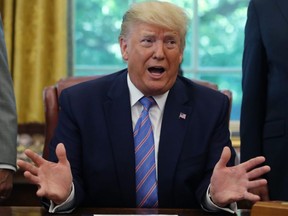 U.S. President Donald Trump speaks to the media after signing a bill for border funding in the Oval Office at the White House in Washington, D.C., on Monday, July 1, 2019.