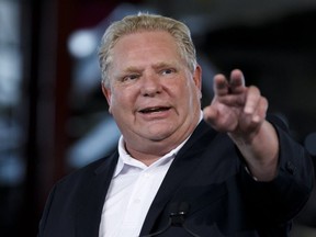 Ontario Premier Doug Ford speaks during an announcement in the the mock-up facility at the Darlington Power Complex, in Bowmanville, Ont., Friday, May 31, 2019. (THE CANADIAN PRESS/Cole Burston)