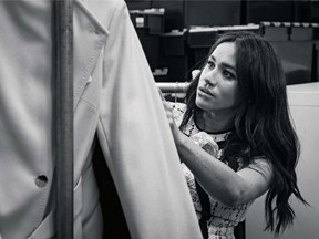 This undated handout photo issued on July 28, 2019 by Kensington Palace shows Britain's Meghan, Duchess of Sussex, Patron of Smart Works, in the workroom of the Smart Works London office.