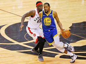 Golden State Warriors forward Kevin Durant loses control of the ball while defended by Toronto Raptors forward Pascal Siakam at Scotiabank Arena. (John E. Sokolowski-USA TODAY Sports)
