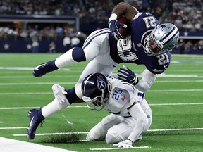Ezekiel Elliott of the Dallas Cowboys gets knocked out of bounds by Adoree' Jackson of the Tennessee Titans at AT&T Stadium on November 5, 2018 in Arlington, Tex. (Tom Pennington/Getty Images)