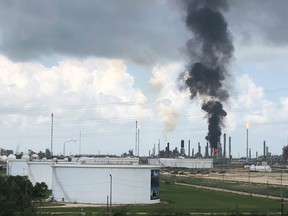 Smoke rises from a fire at Exxon Mobil's refining and chemical plant complex in Baytown, near Houston, Texas, July 31, 2019. (REUTERS/Erwin Seba)