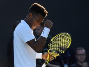 Canada's Felix Auger-Aliassime celebrates winning his second round Wimbledon match against France's Corentin Moutet in London, England, on Tuesday, July 3, 2019.