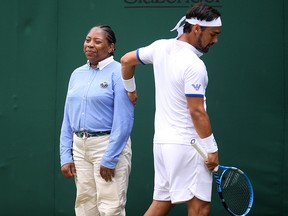Fabio Fognini apologises to a line judge during his match against Tennys Sandgren at All England Lawn Tennis and Croquet Club on July 6, 2019 in London. (Laurence Griffiths/Getty Images)
