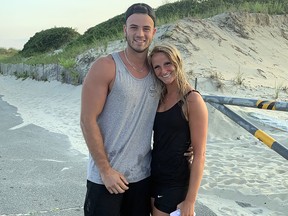 Gabriel Roy poses with his girlfriend Kasandra Rodgers in this handout photo on Horseneck Beach in Westport, Mass.