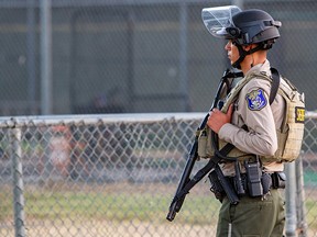 A police officer stands watch at the scene of a mass shooting during the Gilroy Garlic Festival in Gilroy, California, July 28, 2019. (REUTERS/Chris Smead)