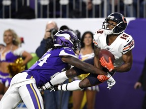 Taylor Gabriel of the Chicago Bears catches the ball over defender Holton Hill of the Minnesota Vikings in the second quarter of the game at U.S. Bank Stadium on December 30, 2018 in Minneapolis, Minnesota.
