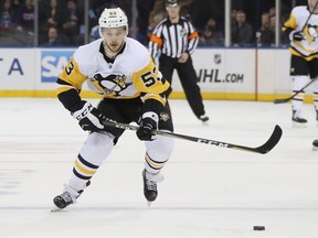 Teddy Blueger  of the Pittsburgh Penguins skates against the New York Rangers at Madison Square Garden on March 25, 2019 in New York City. The Penguins defeated the Rangers 5-2.