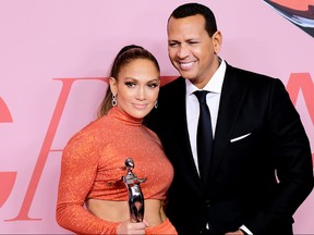 Jennifer Lopez poses with the Fashion Icon Award and Alex Rodriguez during winners walk during the CFDA Fashion Awards at the Brooklyn Museum of Art on June 3, 2019 in New York City.