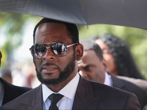 R&B singer R. Kelly leaves the Leighton Criminal Courts Building following a hearing on June 26, 2019 in Chicago, Illinois. Prosecutors turned over to Kelly's defense team a DVD that alleges to show Kelly having sex with an underage girl in the 1990s. Kelly has been charged with multiple sex crimes involving four women, three of whom were underage at the time of the alleged encounters.